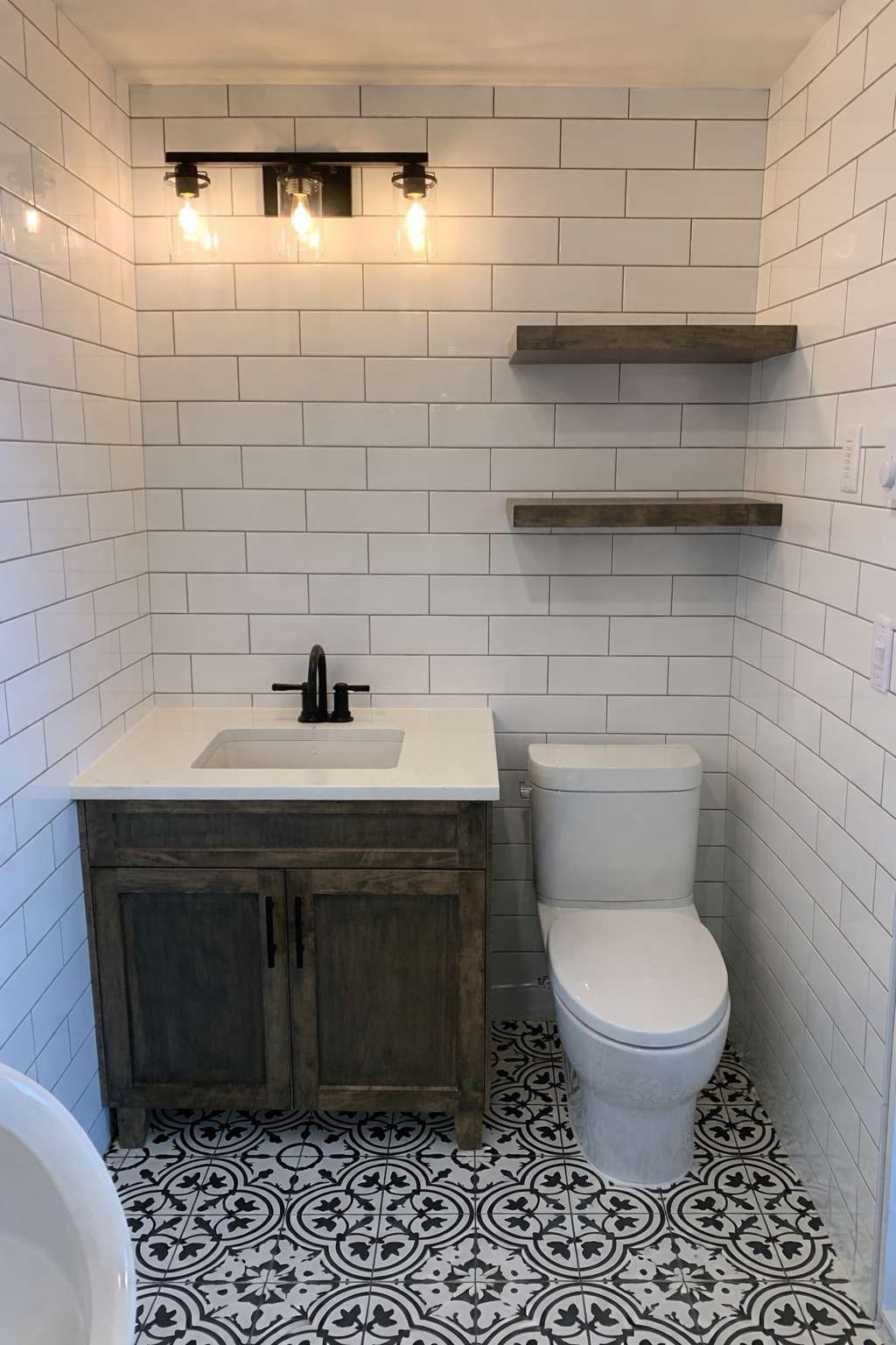 Powder room with patterned floor tile