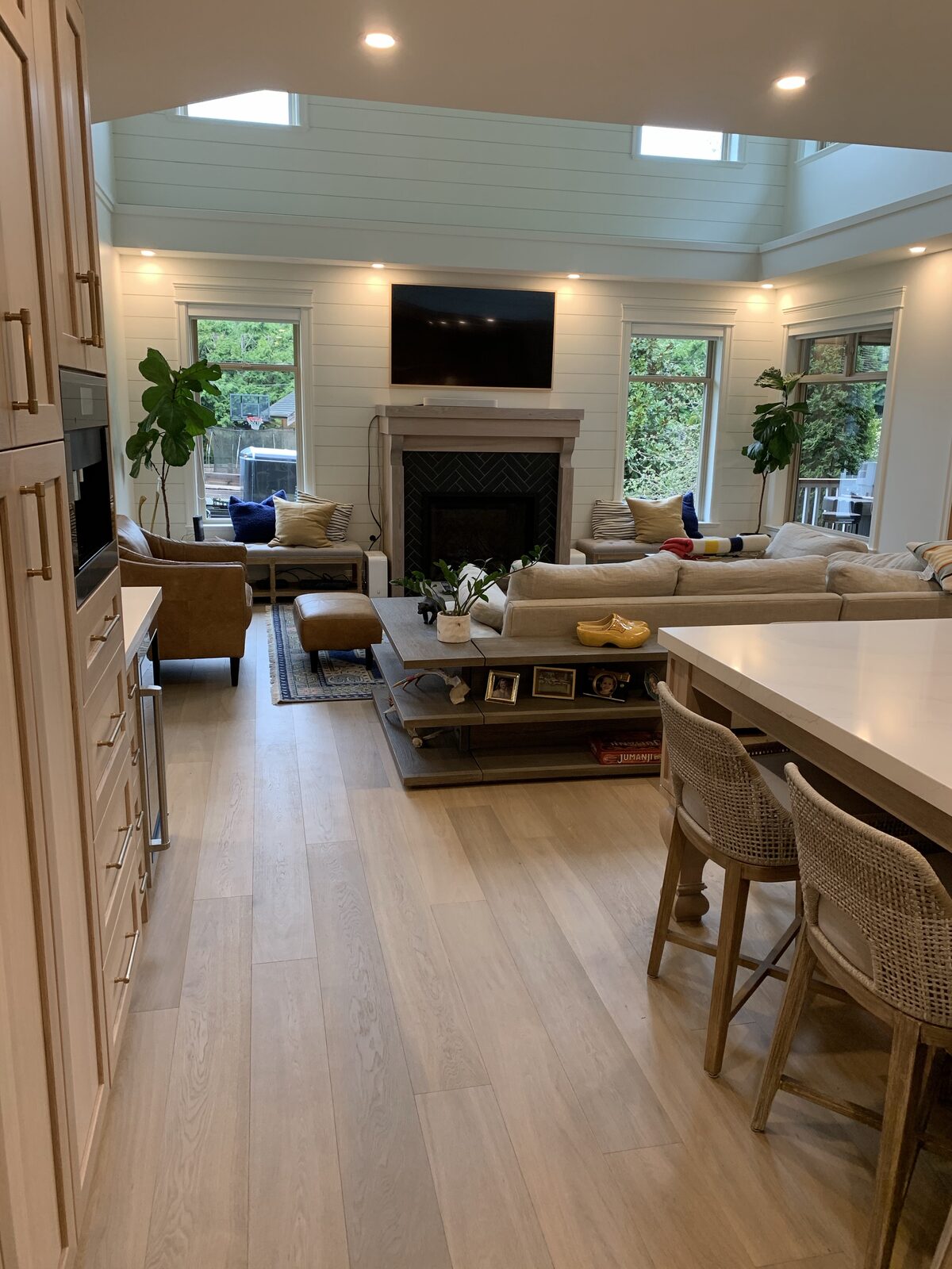 Wide-plank floor in a great room with a fireplace