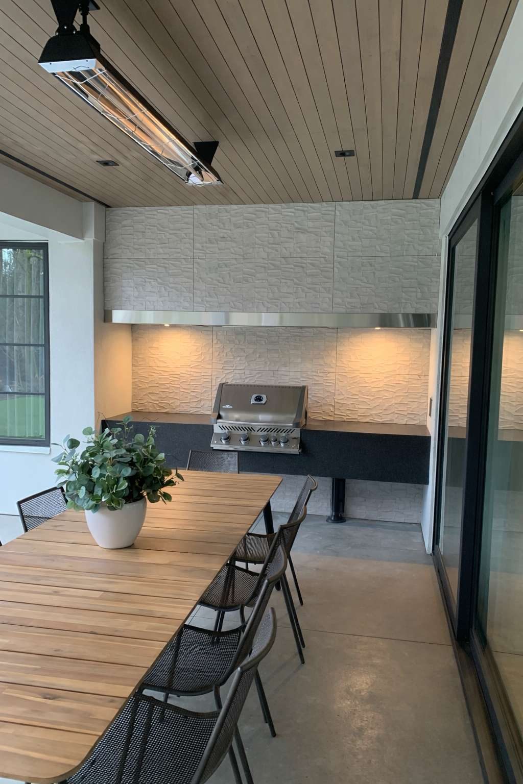 Covered outdoor kitchen and dining area