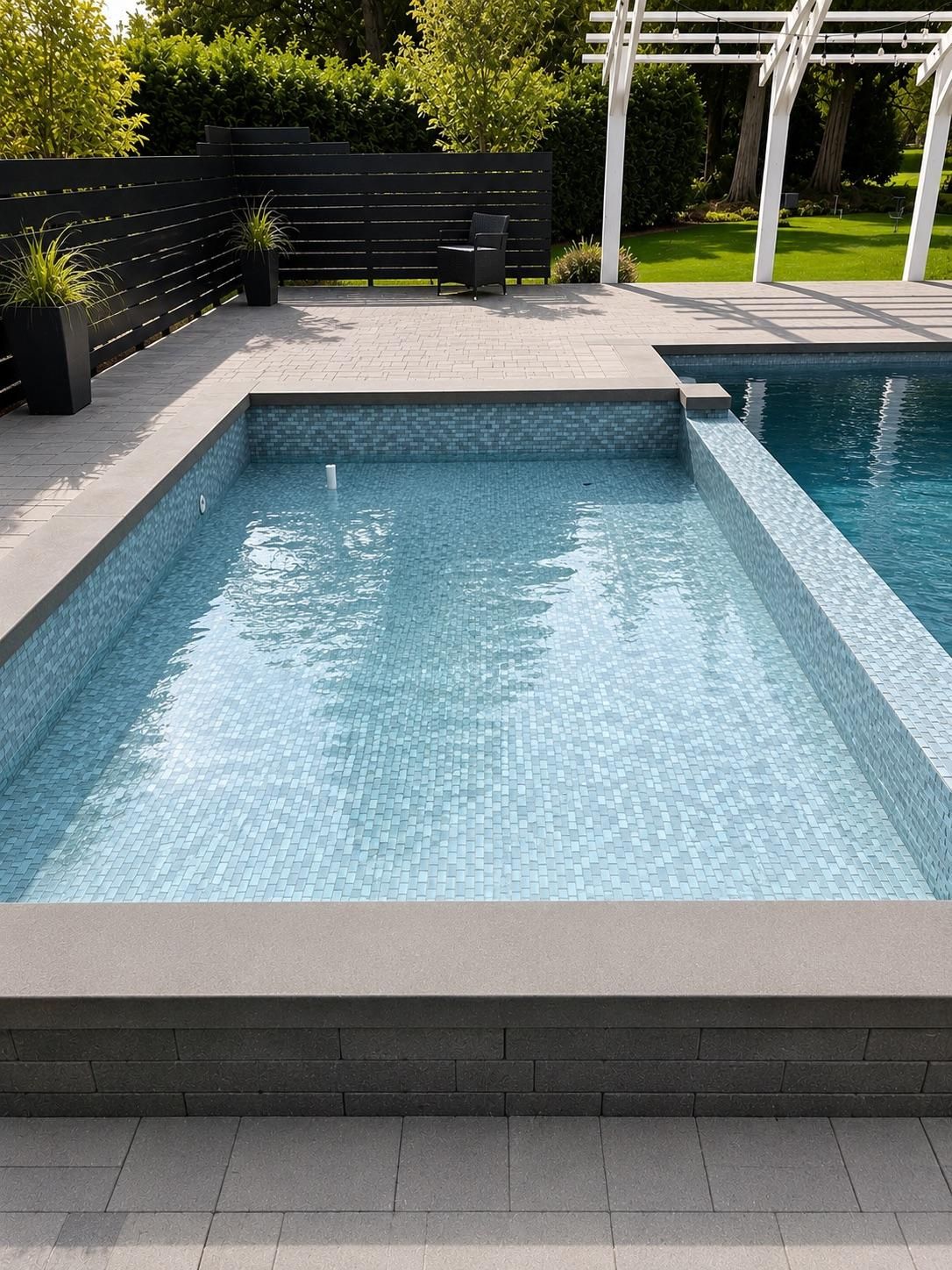 Finished mosaic-tiled pool filled with water